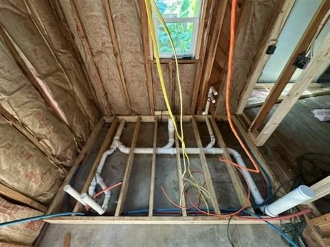 Exposed plumbing lines during emergency repair in Ferry Pass