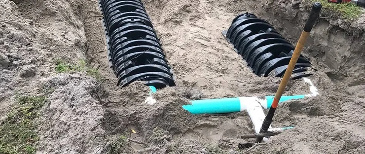 Septic drain field chambers being installed