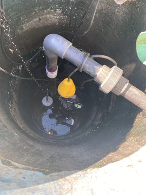 Pump basin with float switches and discharge line