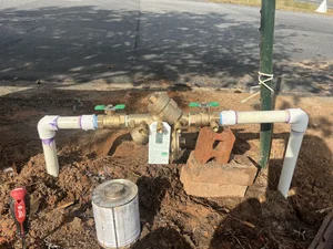 Backflow prevention and pressure regulation setup